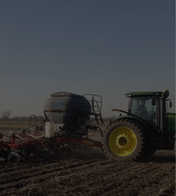 Custom application of Anhydrous Ammonia and dry fertilizer in the same pass.